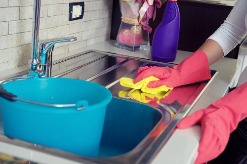 Cleaning technician handling equipment and chemicals safely