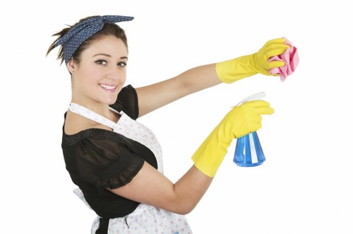 Professional curtain cleaning service removing dust from curtains in Harlington