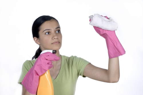 Professional carpet cleaners working safely in a home interior